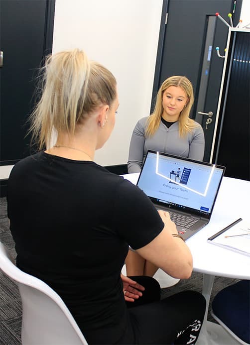 Our consultant discussing DEXA body composition scan results with a customer